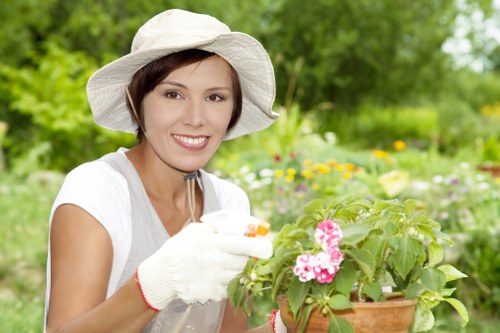 Landscapers sorting green waste for eco-friendly disposal in Gipsyhill